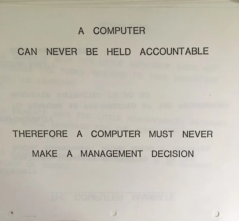 A slide that reads: A computer can never be held accountable. Therefore a computer must never make a management decision.